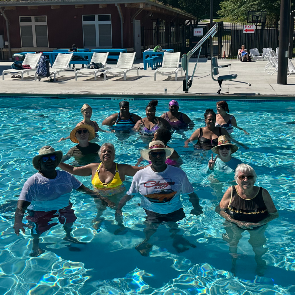youth playing with a water football in the pool