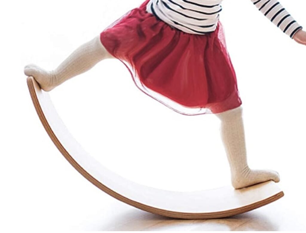 Stock image of a child on a wobble balance board